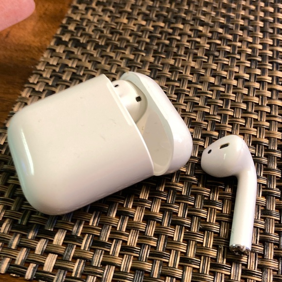 Apple AirPods first generation with cover. - Picture 1 of 2
